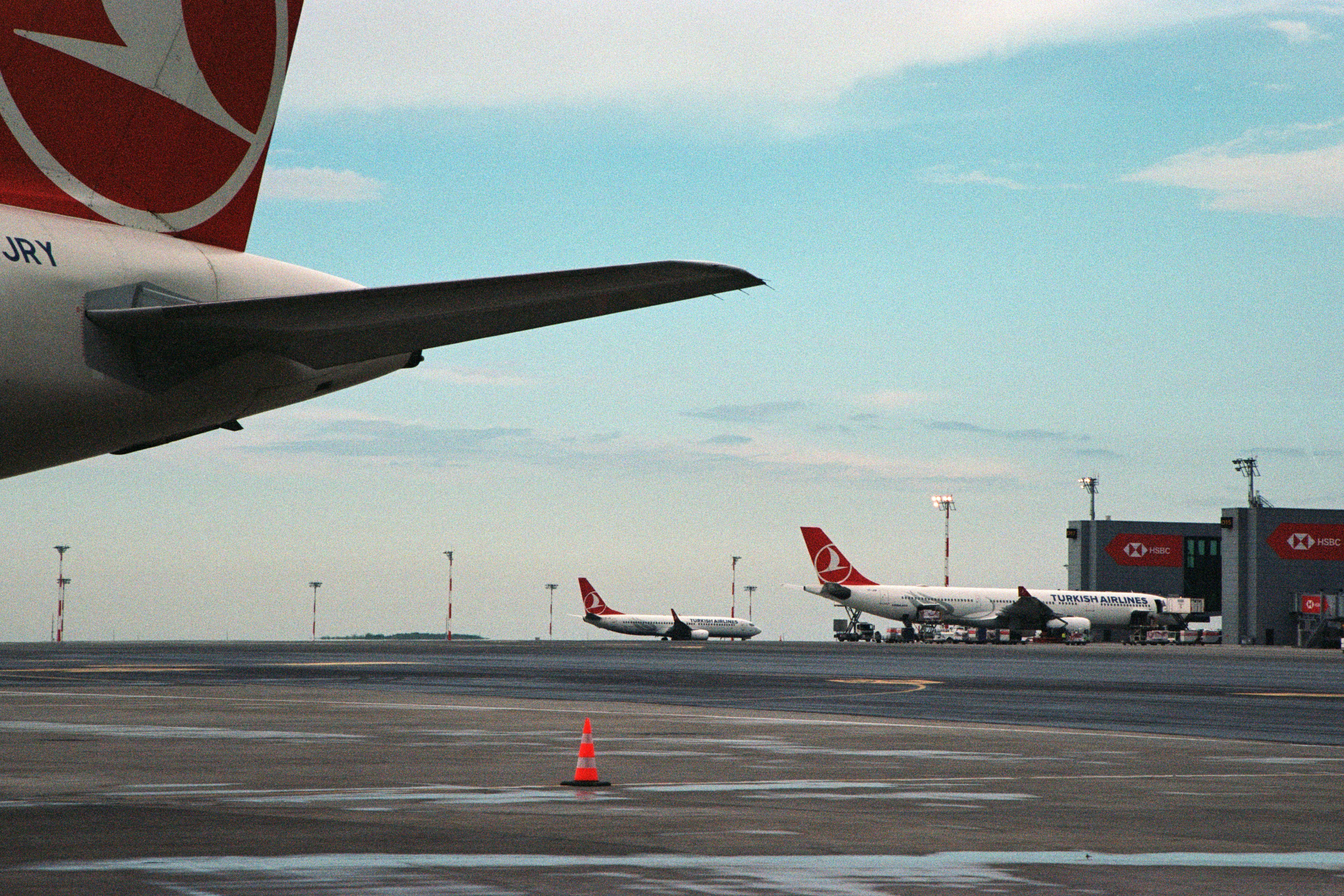 a number of airplanes on a run way, 