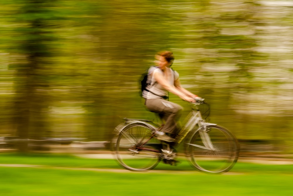 a blurry photo of a person riding a bike