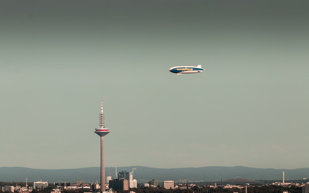 a large air plane flying over a city