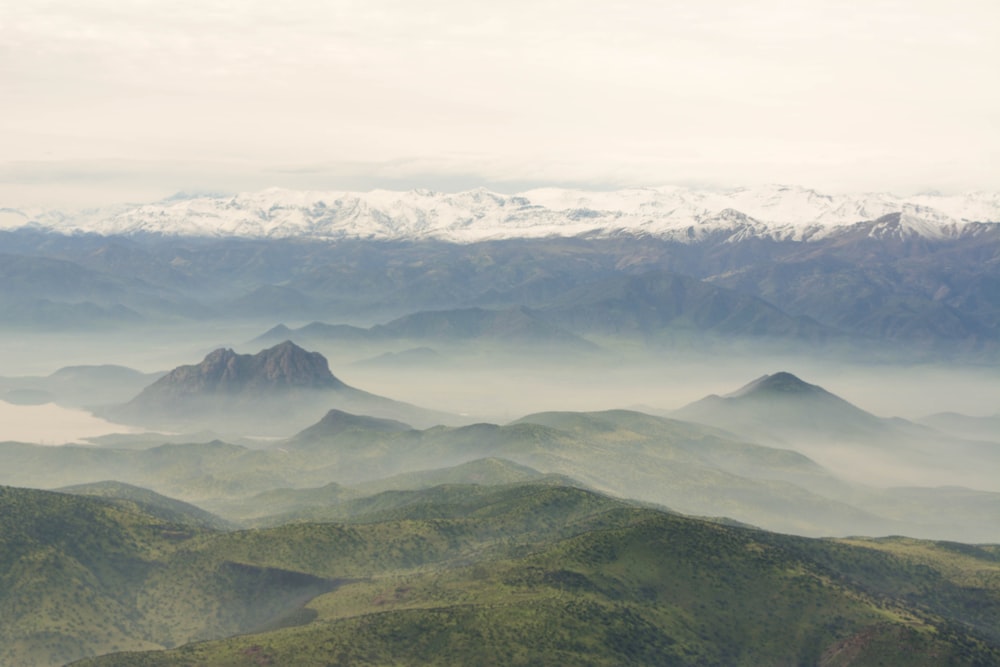 a view of a mountain range covered in fog