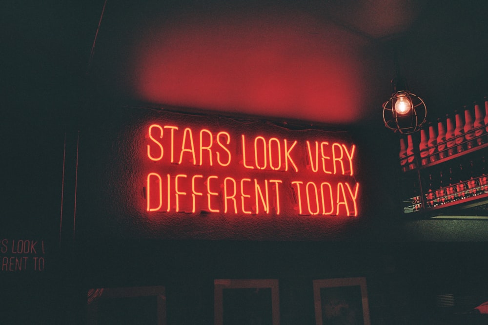 a neon sign that says stars look very different today