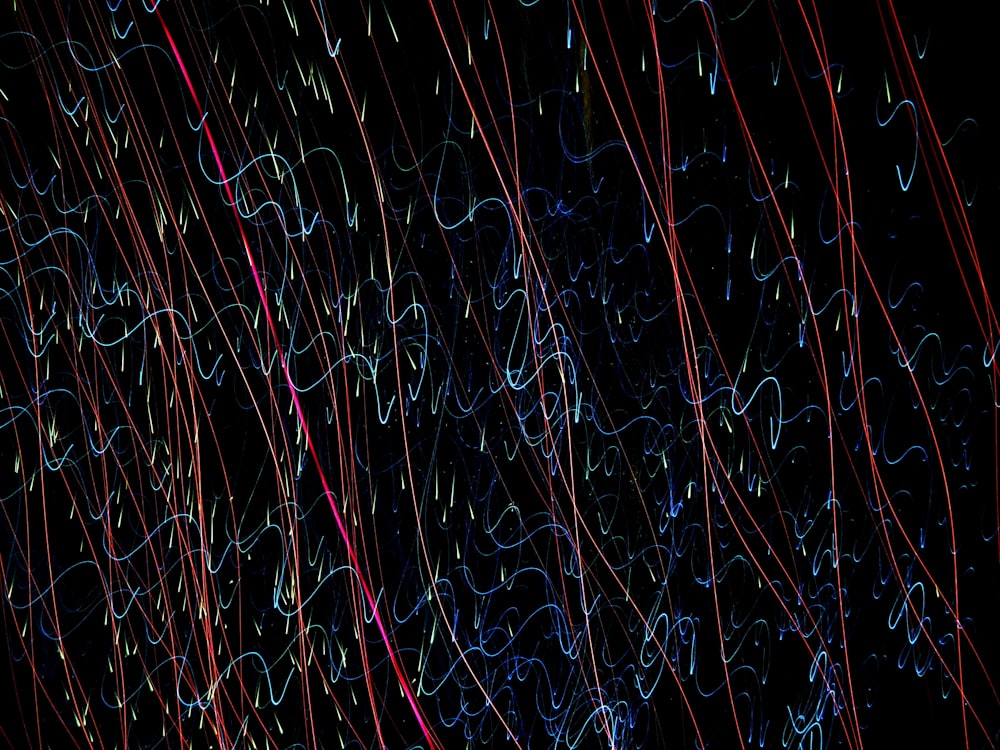 a black background with red and blue lines