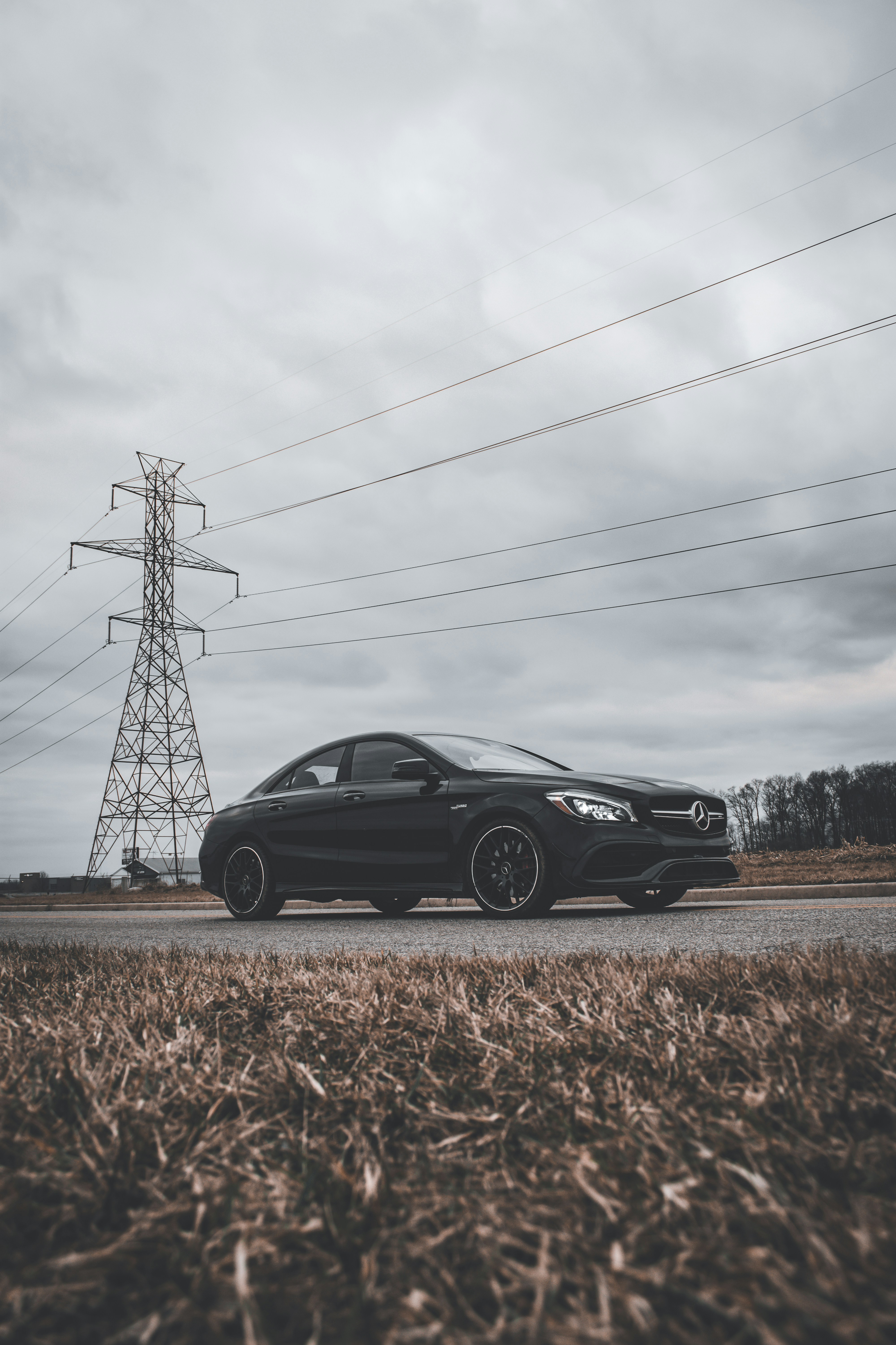 a black car parked on the side of the road
