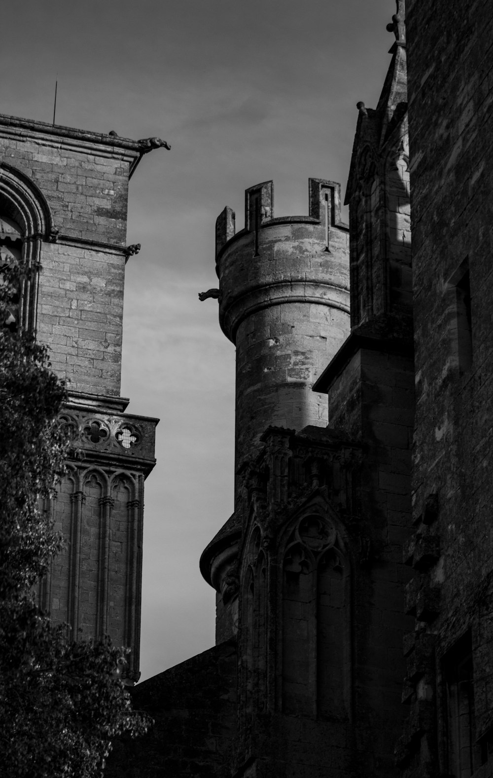a black and white photo of two towers