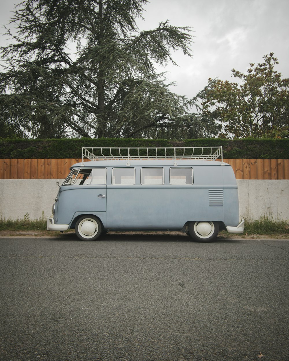 a blue van parked on the side of the road