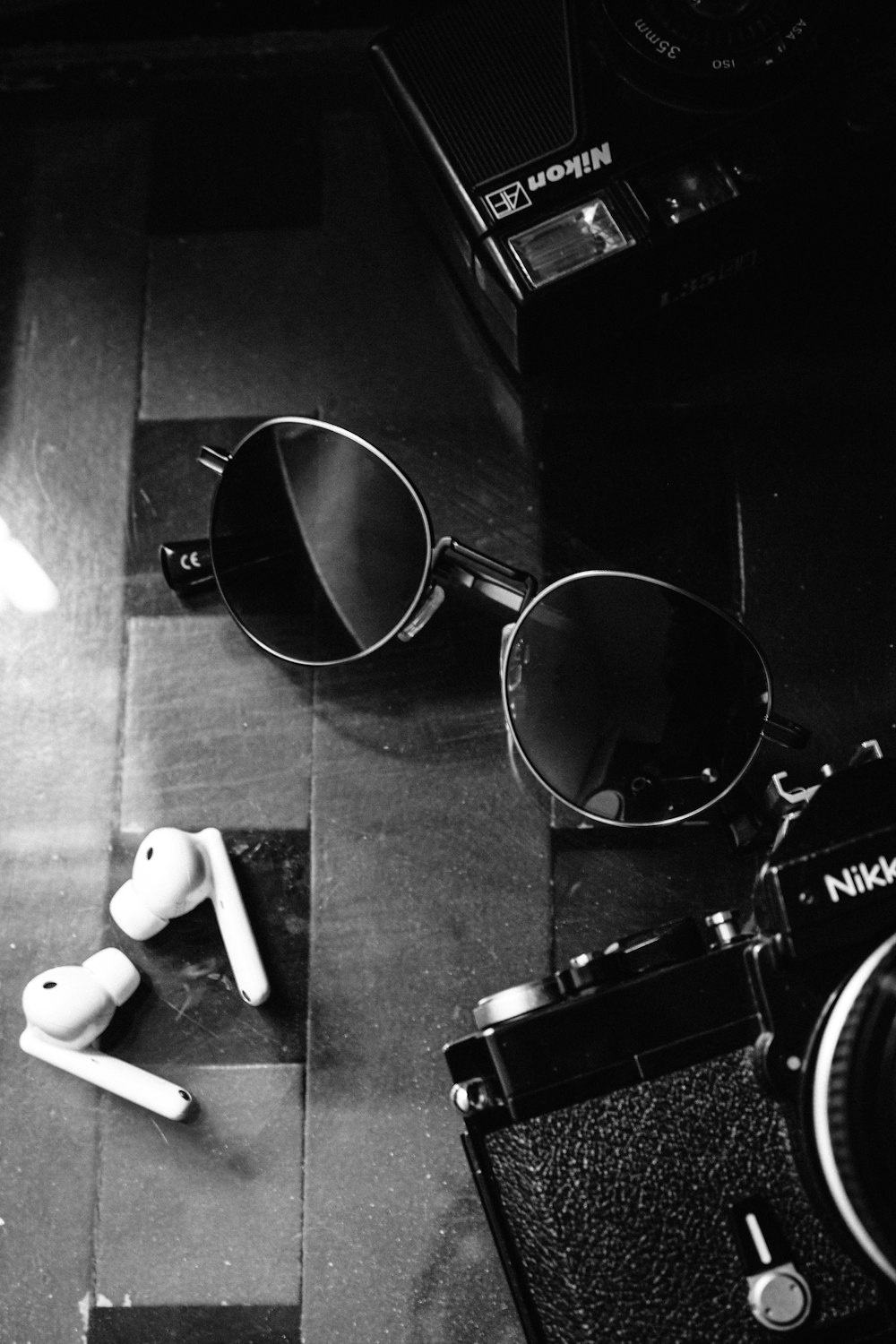 a pair of glasses and a camera on a table