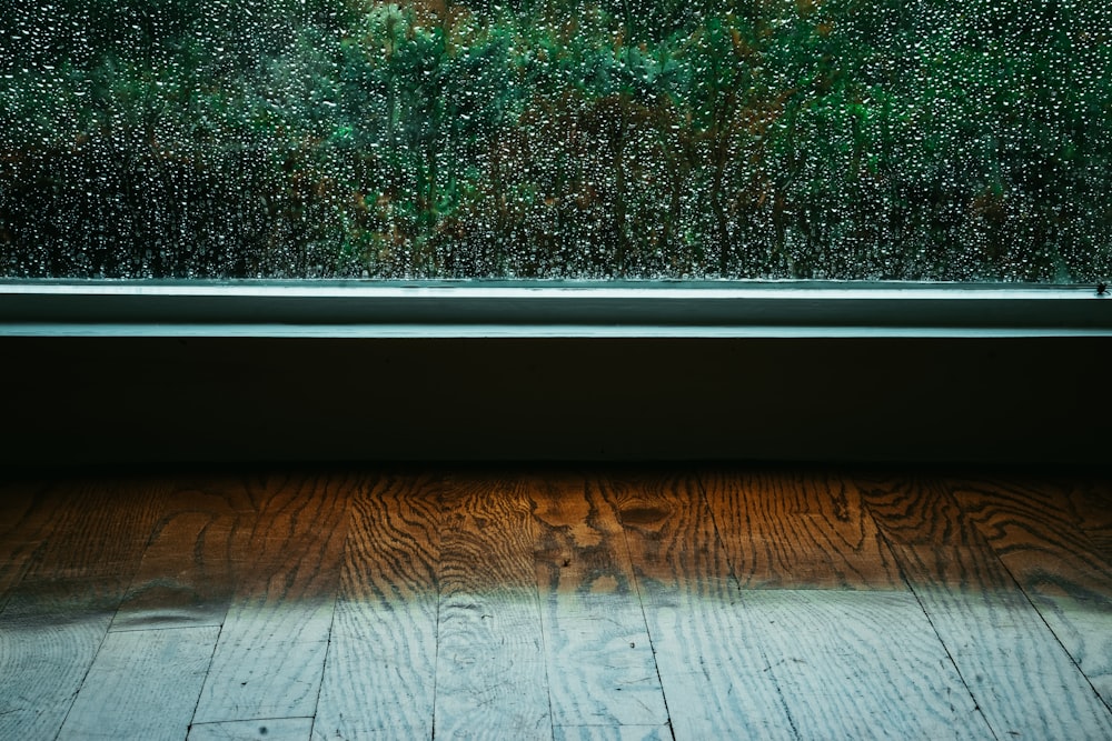 a window with rain drops on the glass