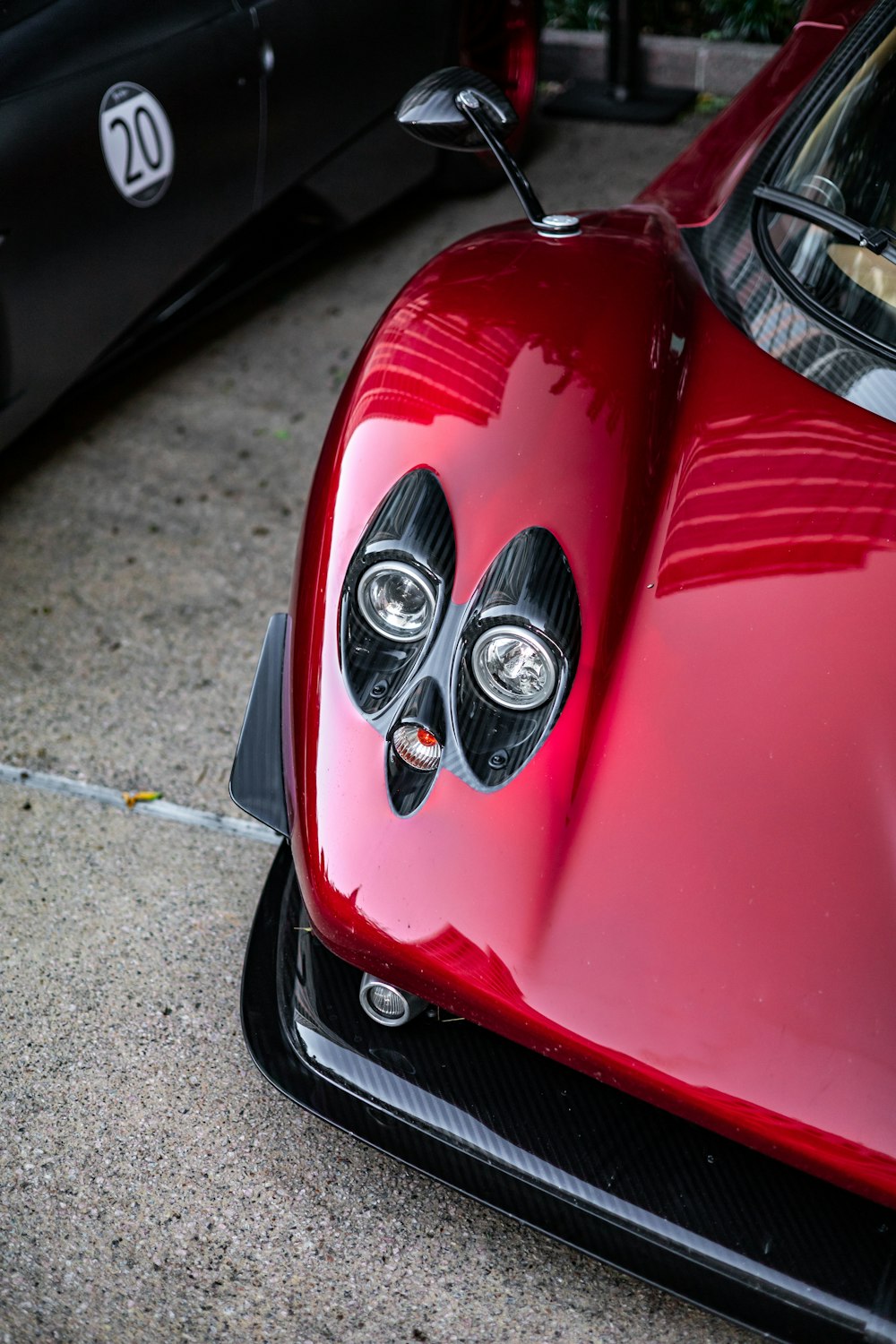 a close up of the front of a red sports car