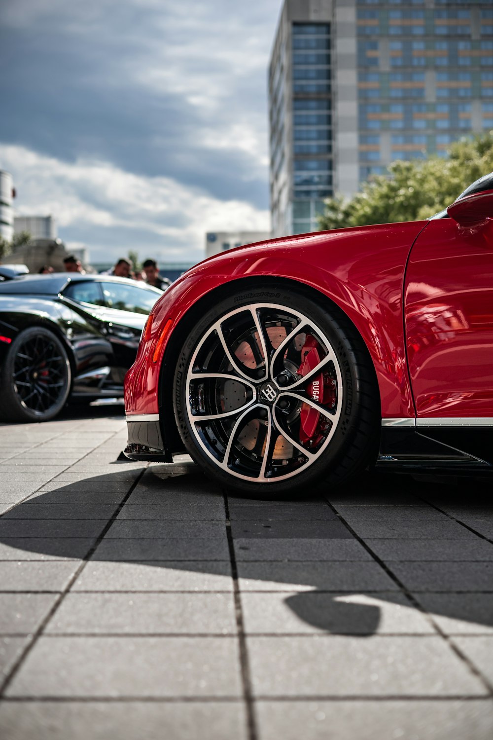 a red sports car parked in a parking lot