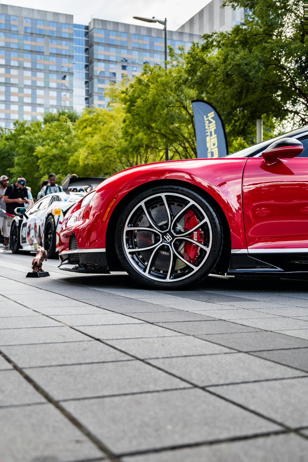 a red sports car parked on the side of the road