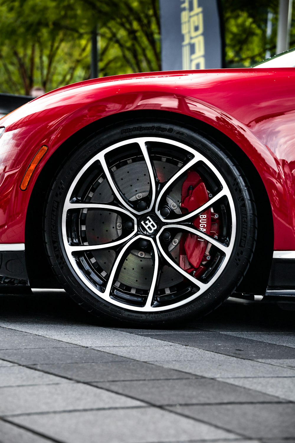 a red sports car parked on the side of the road