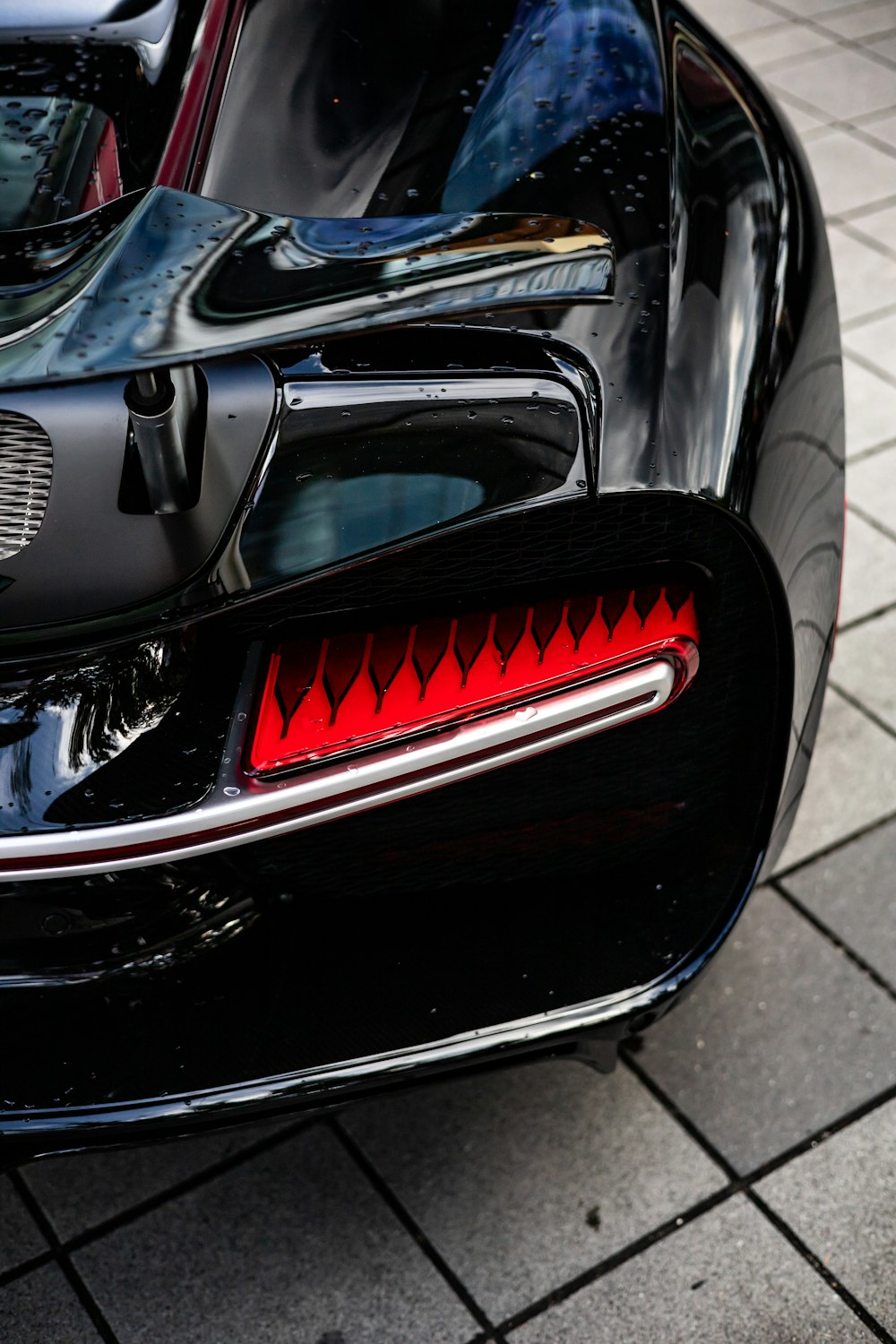 a close up of the tail lights of a sports car