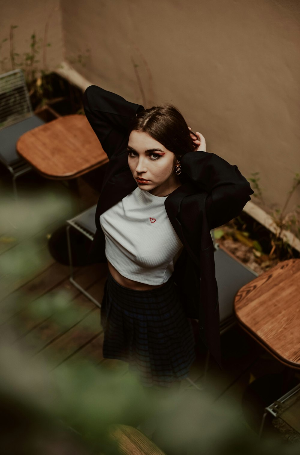 a woman in a white shirt and a black jacket