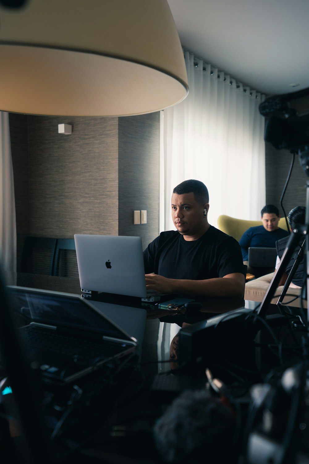 a man sitting in front of a laptop computer