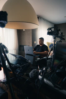a man sitting in front of a laptop computer