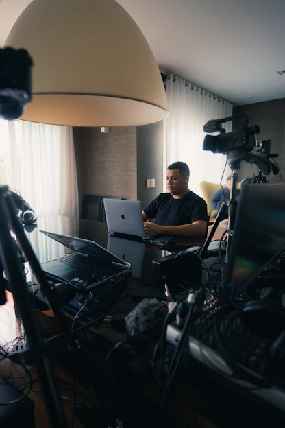 a man sitting in front of a laptop computer