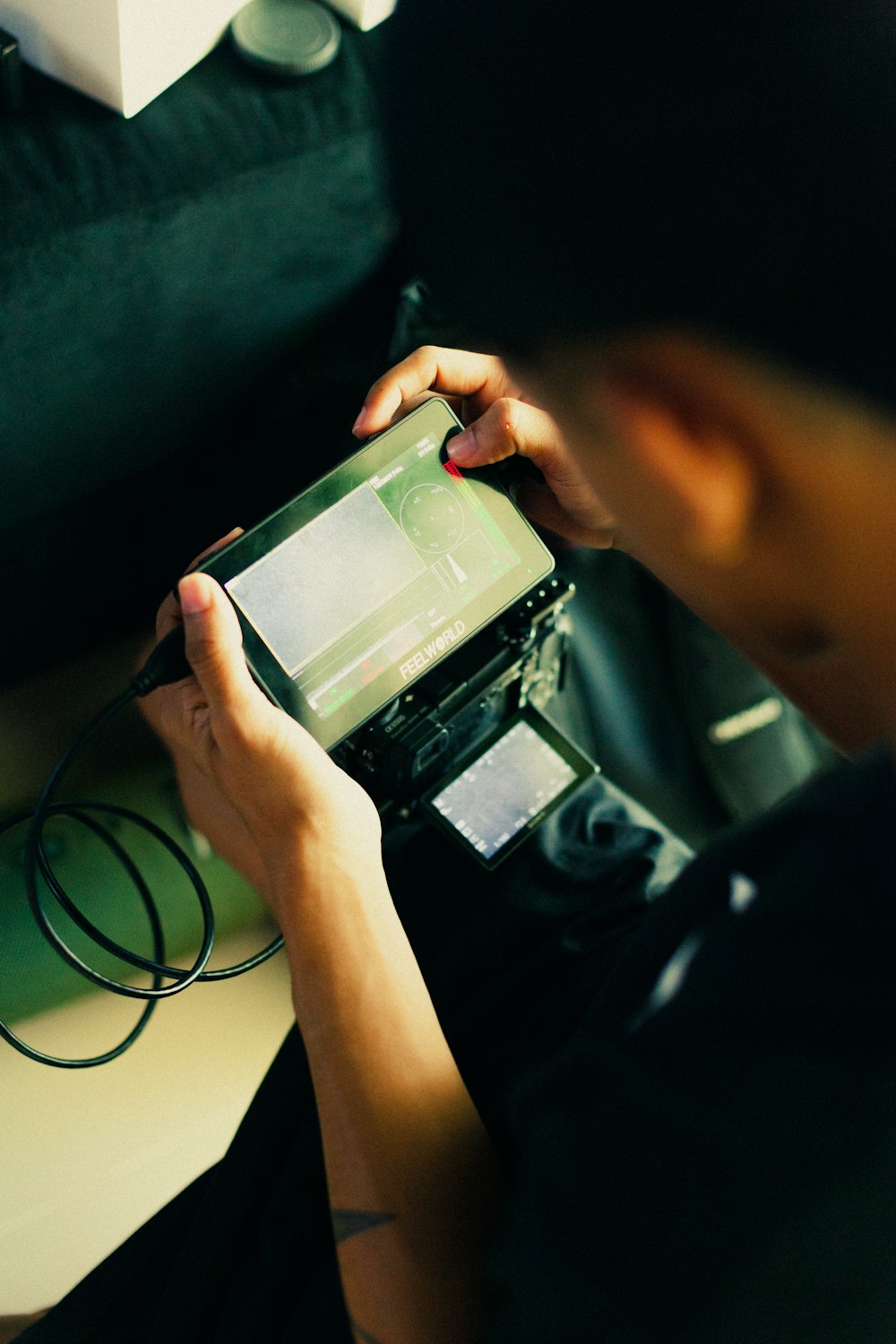 a person holding a cell phone in their hands