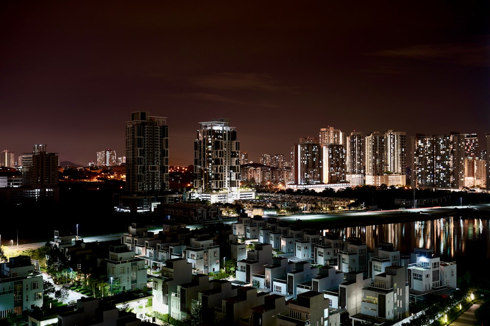 a night view of a city and a body of water