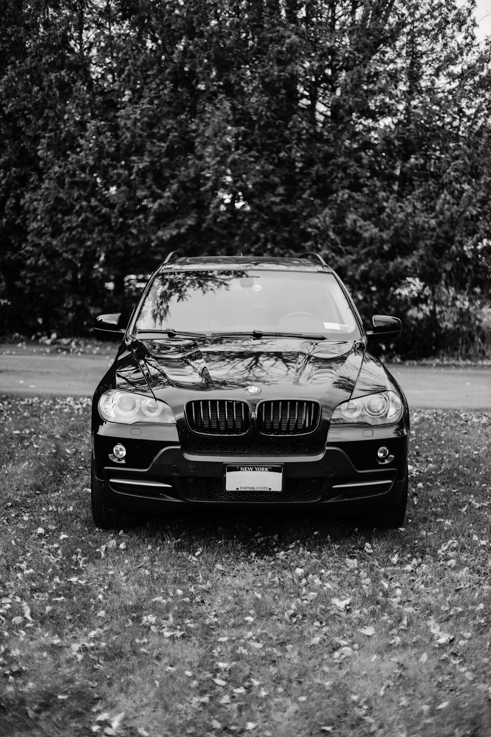 a black and white photo of a bmw