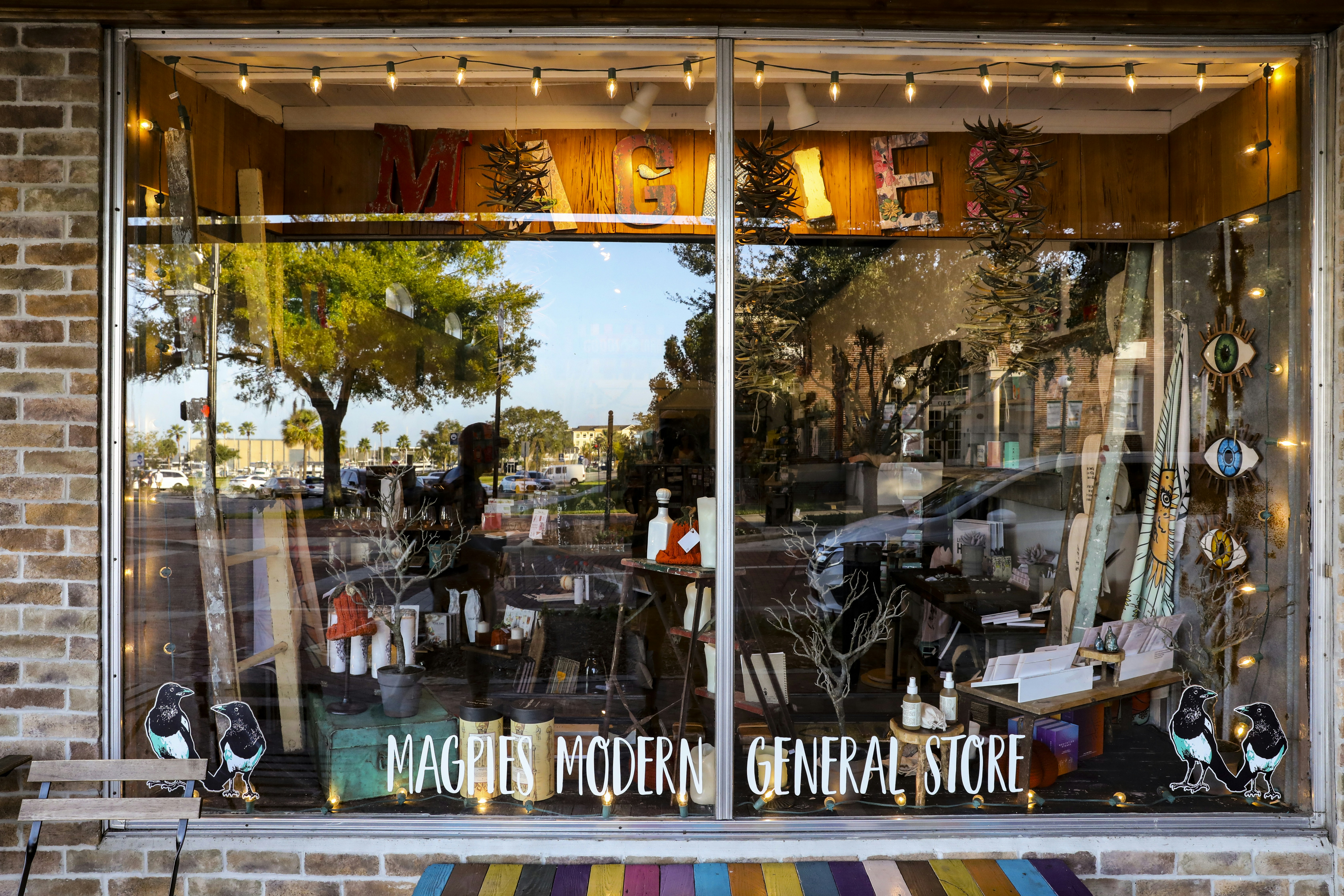 a store front with a variety of items in the window
