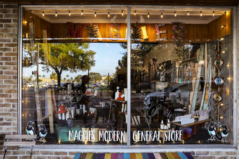 a store front with a variety of items in the window