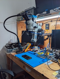 a workbench with a computer and tools on it