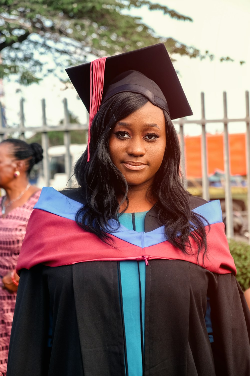 a woman in a graduation gown and cap