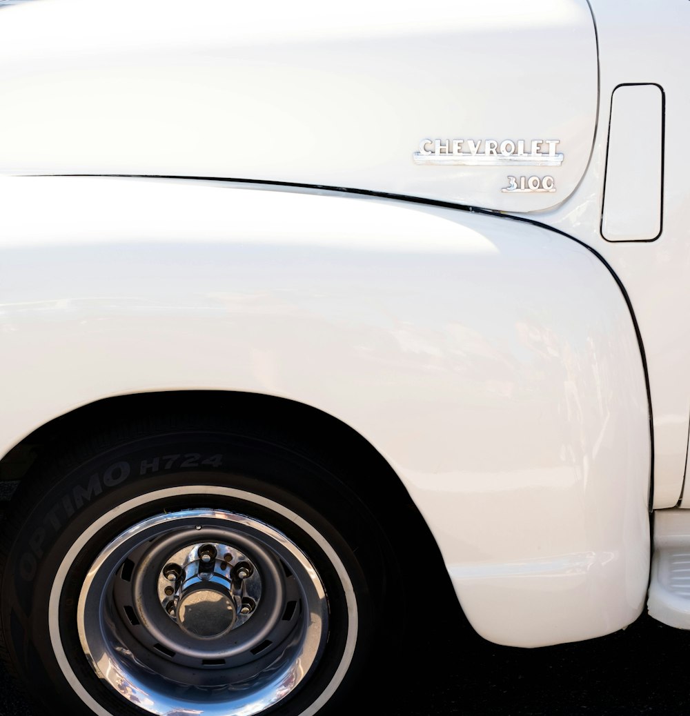 a white truck parked in a parking lot