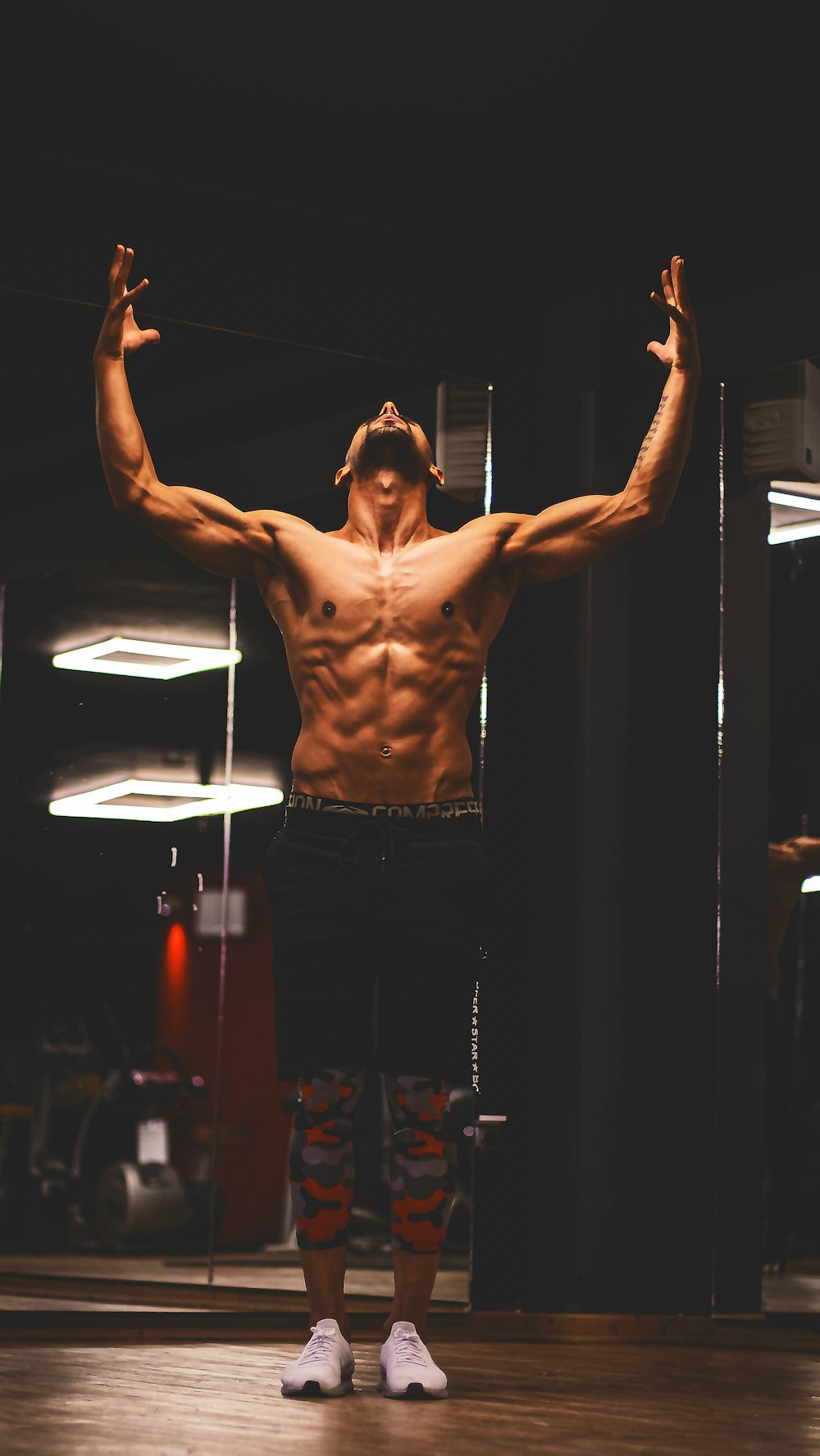 a man standing on top of a hard wood floor