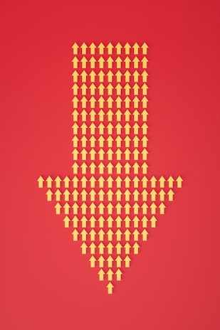 a red background with a yellow dotted arrow