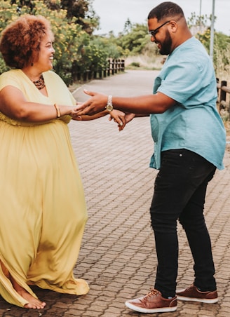 a woman in a yellow dress and a man in a blue shirt