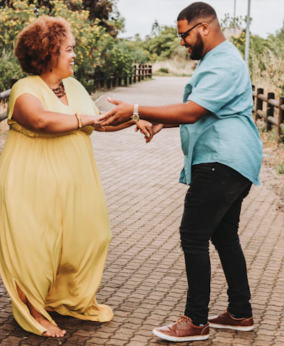 a woman in a yellow dress and a man in a blue shirt