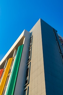 A completed building with a sleek design and vibrant colors.