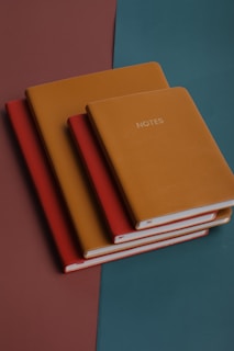 Set of corporate notebooks arranged neatly, highlighting different textures and finishes
