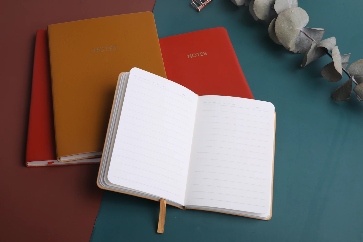 A Raster Pocket Trio notebook open on the desk — in stock