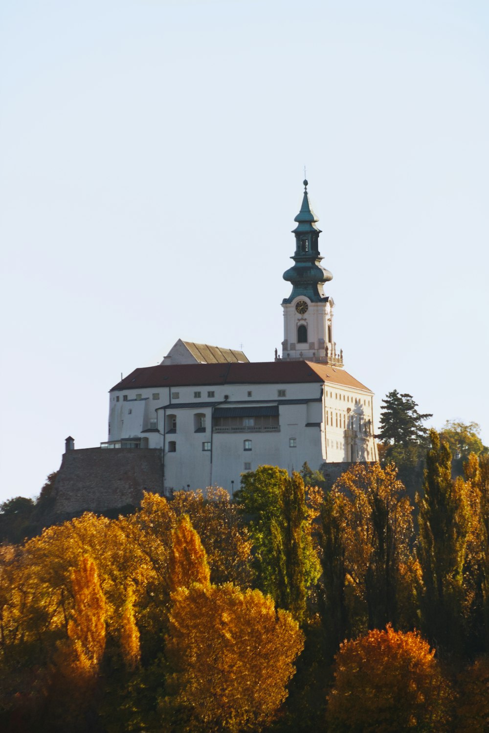 a large white building on top of a hill