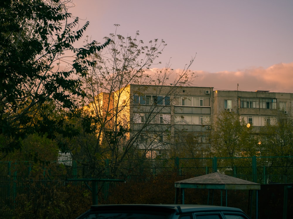 a car parked in front of a tall building