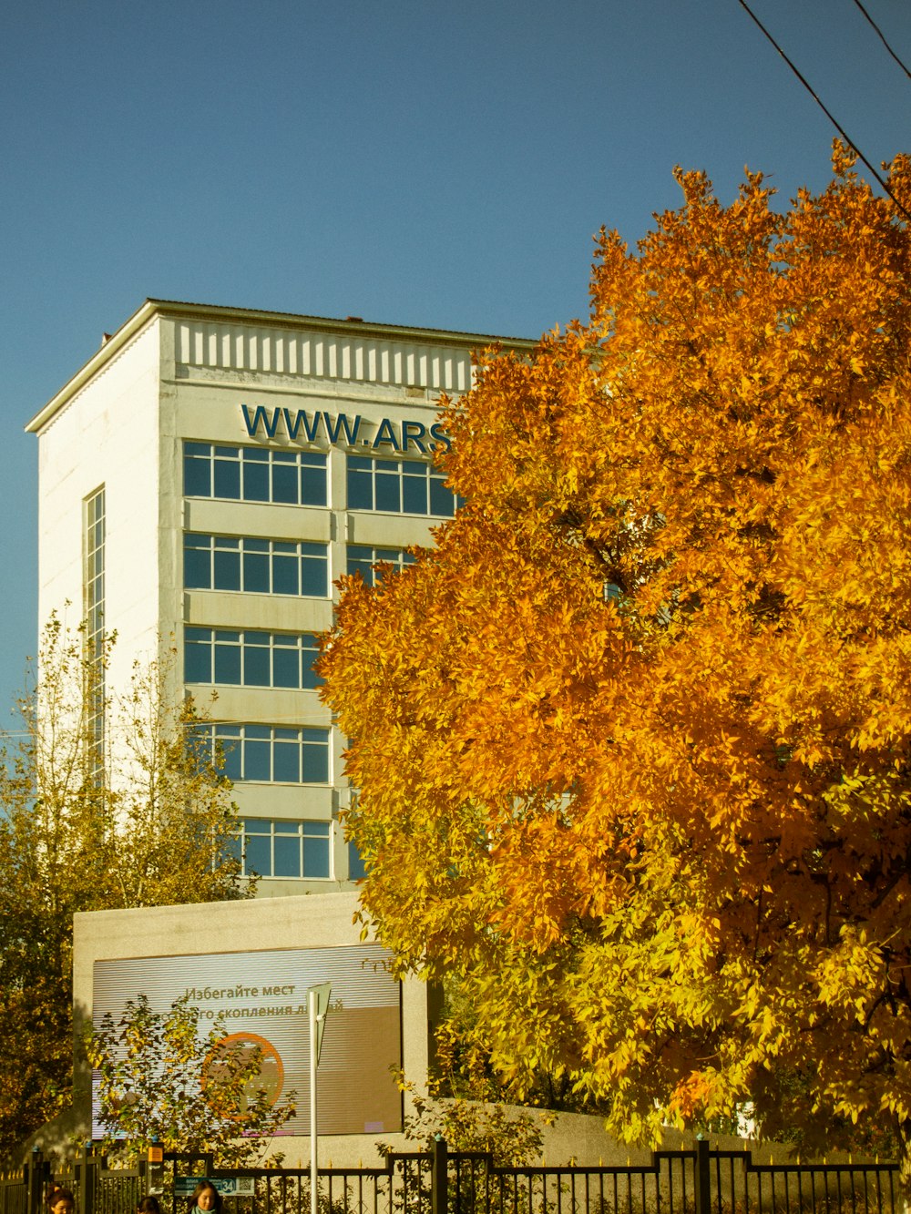 a tall building with a sign on top of it