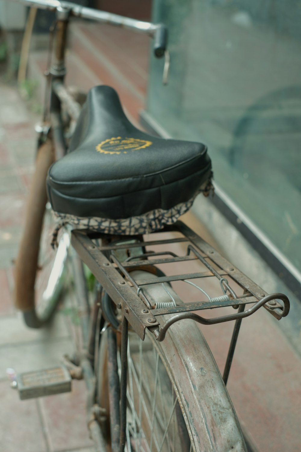 a close up of a bicycle parked on a sidewalk