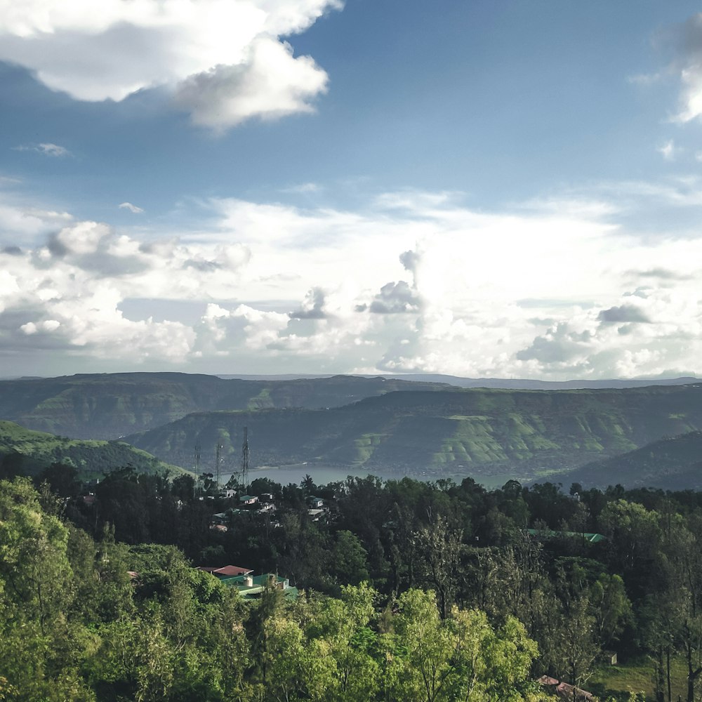 a scenic view of a valley and mountains