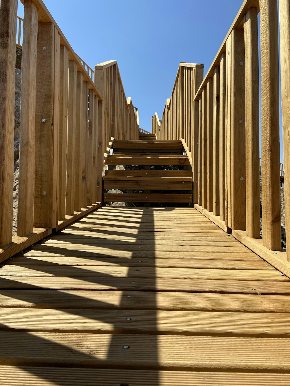 a set of wooden stairs leading up to the top of a hill