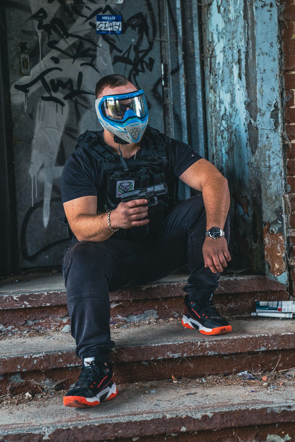 a man sitting on some steps with a cell phone