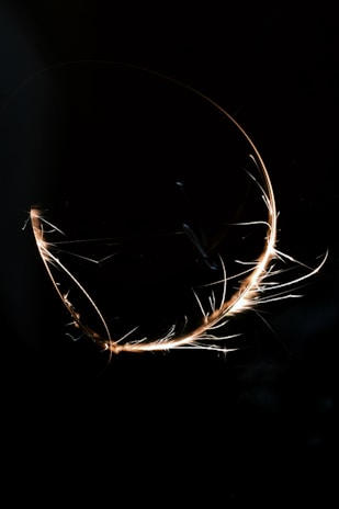 A custom glowing cursor effect expanding over a clickable element on a dark, immersive digital background.