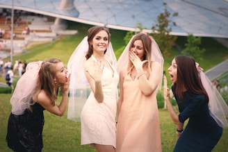 a group of young women standing next to each other