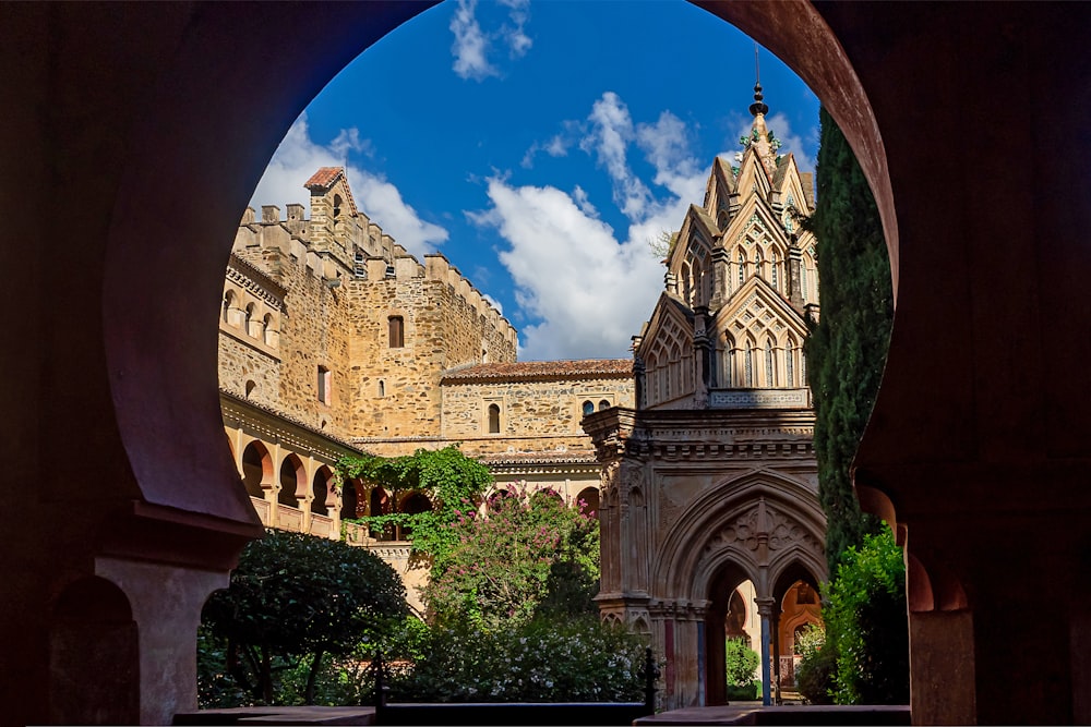 a view of a castle through an archway