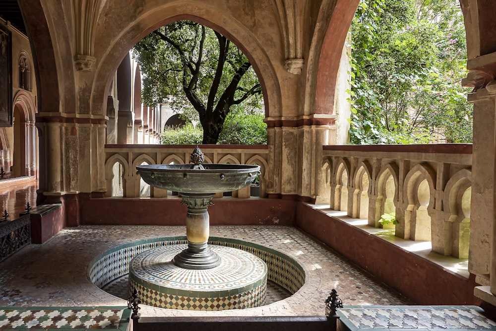 a fountain in the middle of a courtyard