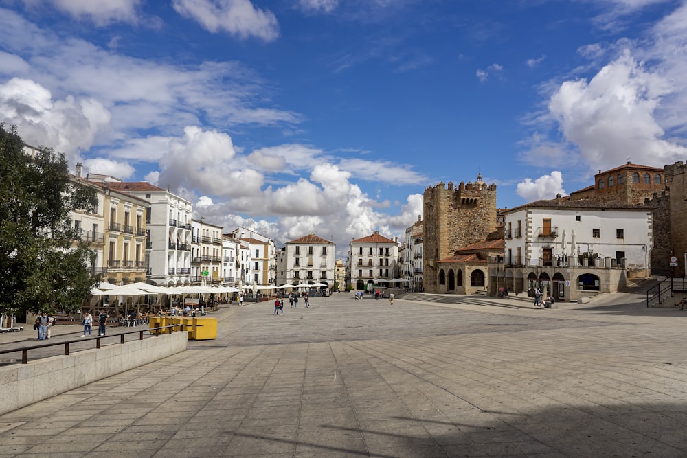 a city square with a few people walking around