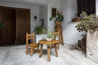 a small table and two chairs in a room