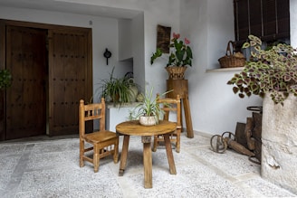 a small table and two chairs in a room
