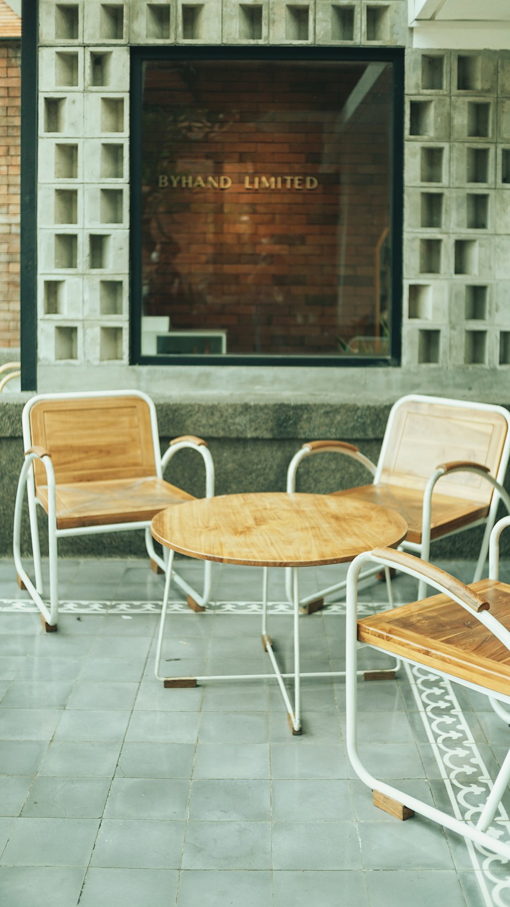 a couple of wooden chairs sitting next to each other